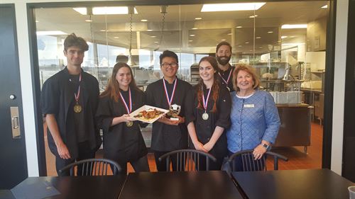 Students receiving cooking awards